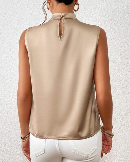 Satin sleeveless twist-neck blouse